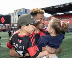Fury players and children hugging